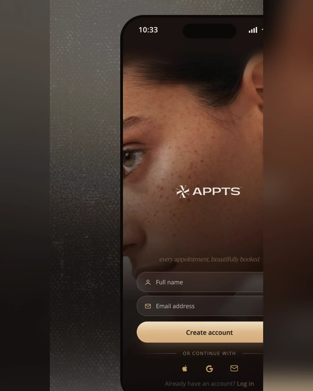 The Appts sign-up screen on a phone over a dark ground